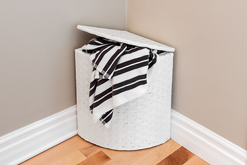 Image showing Laundry basket in the room corner