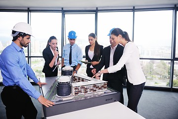 Image showing business people and engineers on meeting