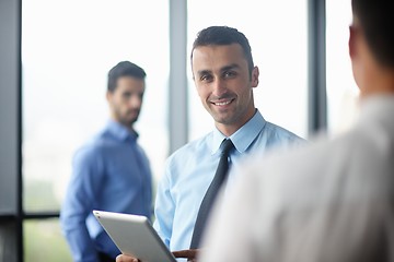 Image showing business man using tablet compuer at office