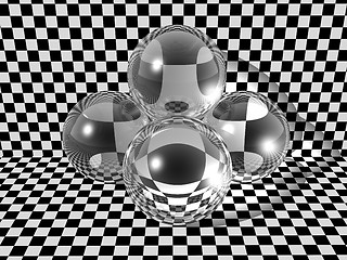 Image showing Three glass balls on checkerboard background