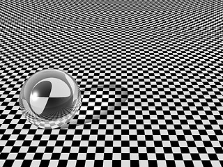 Image showing Clear glass ball on checkerboard background