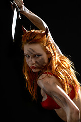 Image showing red devil girl with a knife