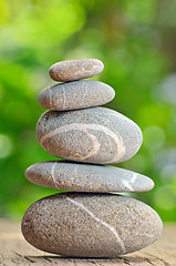 Image showing Stack of Stones on a wooden table
