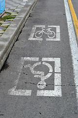 Image showing Road marking for disabled people and a bicycle path.