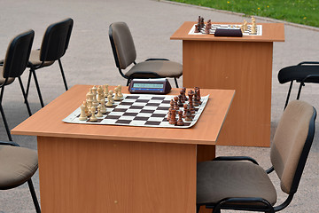 Image showing street tournament on chess on a holiday day of the athlete. Tyum