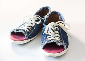 Image showing Denim shoes on white background