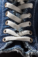 Image showing Close-up of denim shoe laces