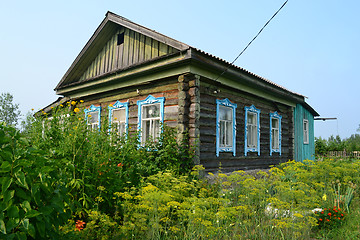 Image showing The wooden house in the village in the summer.