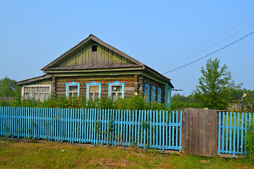 Image showing The wooden house in the village in the summer.