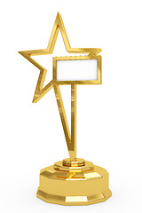 Image showing Golden star prize on pedestal with blank white plate