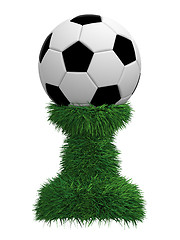 Image showing Soccer ball trophy on green grass pedestal