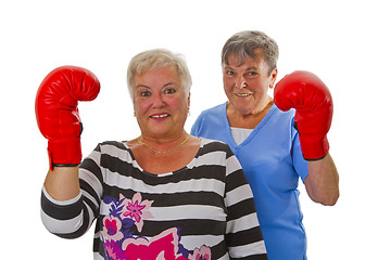 Image showing Two female seniors with red boxing glove