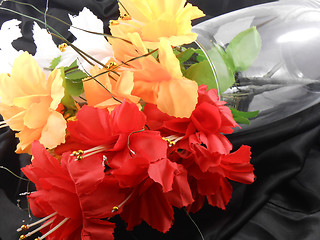 Image showing White, red and yellow flowers on glass vase