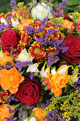 Image showing Mixed floral arrangement in yellow, red and white