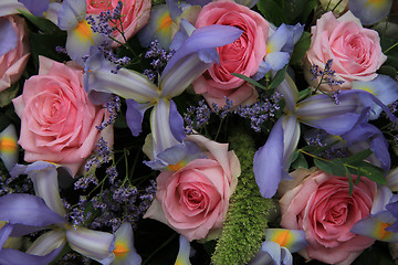 Image showing Blue irises and pink roses in bridal arrangement