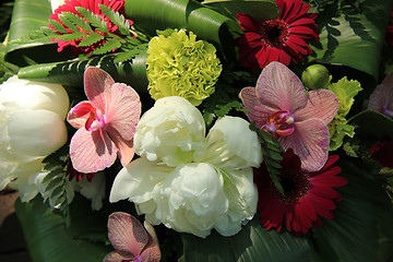 Image showing Orchids and peonies in a bridal arrangement