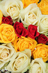 Image showing Yellow, white and red roses in a wedding arrangement