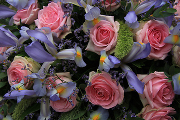 Image showing Blue irises and pink roses in bridal arrangement