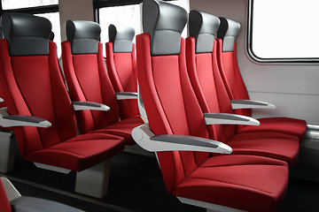 Image showing rows of red seats in train