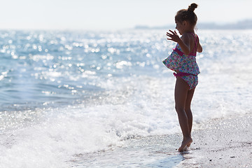 Image showing Little five year old girl at the beach