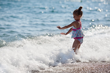 Image showing Happy little girl and sea