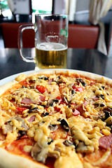 Image showing tasty appetizing pizza and glass of beer