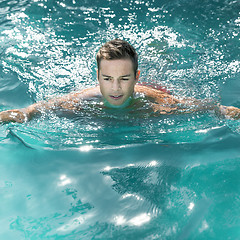 Image showing young man swimming