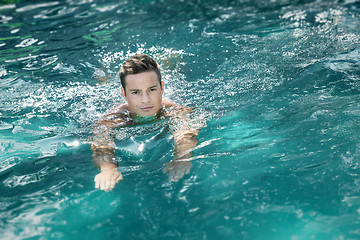 Image showing young man swimming