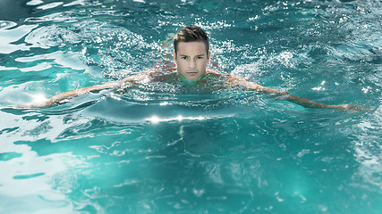 Image showing young man swimming