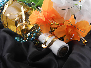 Image showing bottle of champagne and flowers. festive arrangement with sparkling wine and flowers