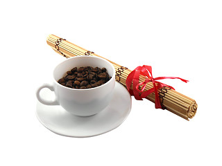 Image showing coffee cup with coffee beans and bamboo isolated on white