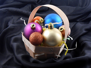 Image showing Christmas toy balls on black material background