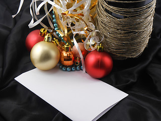 Image showing bottle champagne wine with christmas balls and blank invitation paper