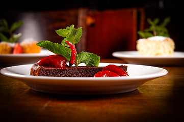 Image showing Chocolate cake wth strawberry and chili