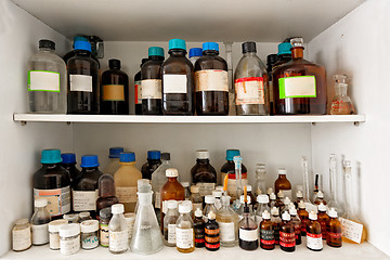 Image showing old laboratory with a lot of bottles