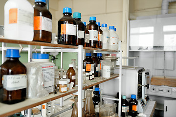 Image showing old laboratory with a lot of bottles