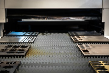 Image showing Laser cutter cutting metal plates
