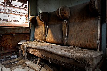 Image showing Damaged retro seats in a cabin