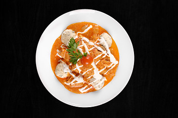 Image showing Delicious stew on isolated black background