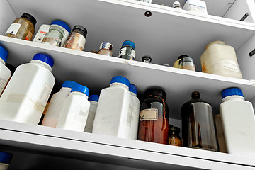 Image showing old laboratory with a lot of bottles