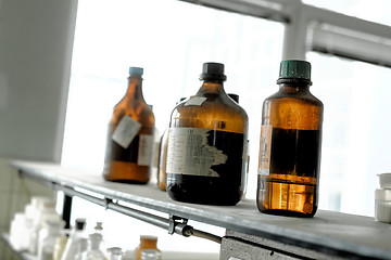 Image showing old laboratory with a lot of bottles