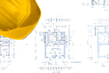 Image showing Helmet of an engineer with plans