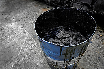 Image showing Damaged oil drums in industrial interior