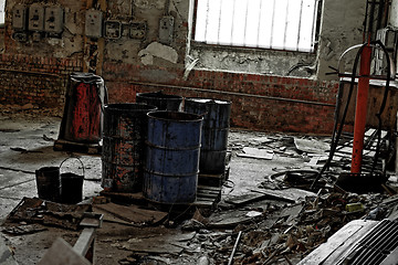 Image showing Damaged oil drums in industrial interior