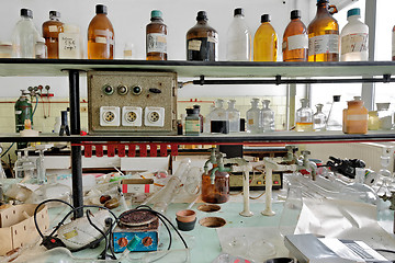 Image showing old laboratory with a lot of bottles