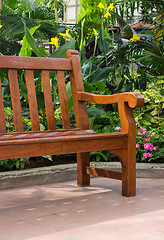 Image showing Wooden bench in the tropical garden