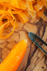 Image showing Peeling Carrots