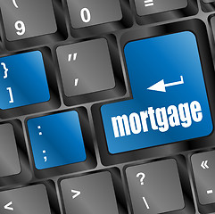 Image showing Keyboard with single blue button showing the word mortgage