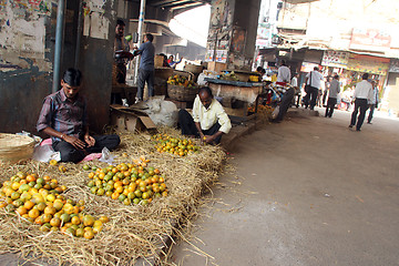 Image showing Seller sells fruits on the outdoor market, Kolkata