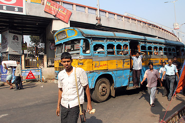 Image showing People on the move come in the colorful bus, Kolkata